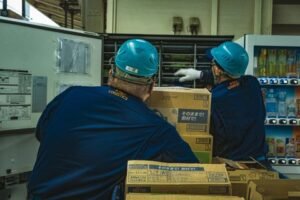 Small Business Websites 50 Warehouse workers handling boxes for delivery
