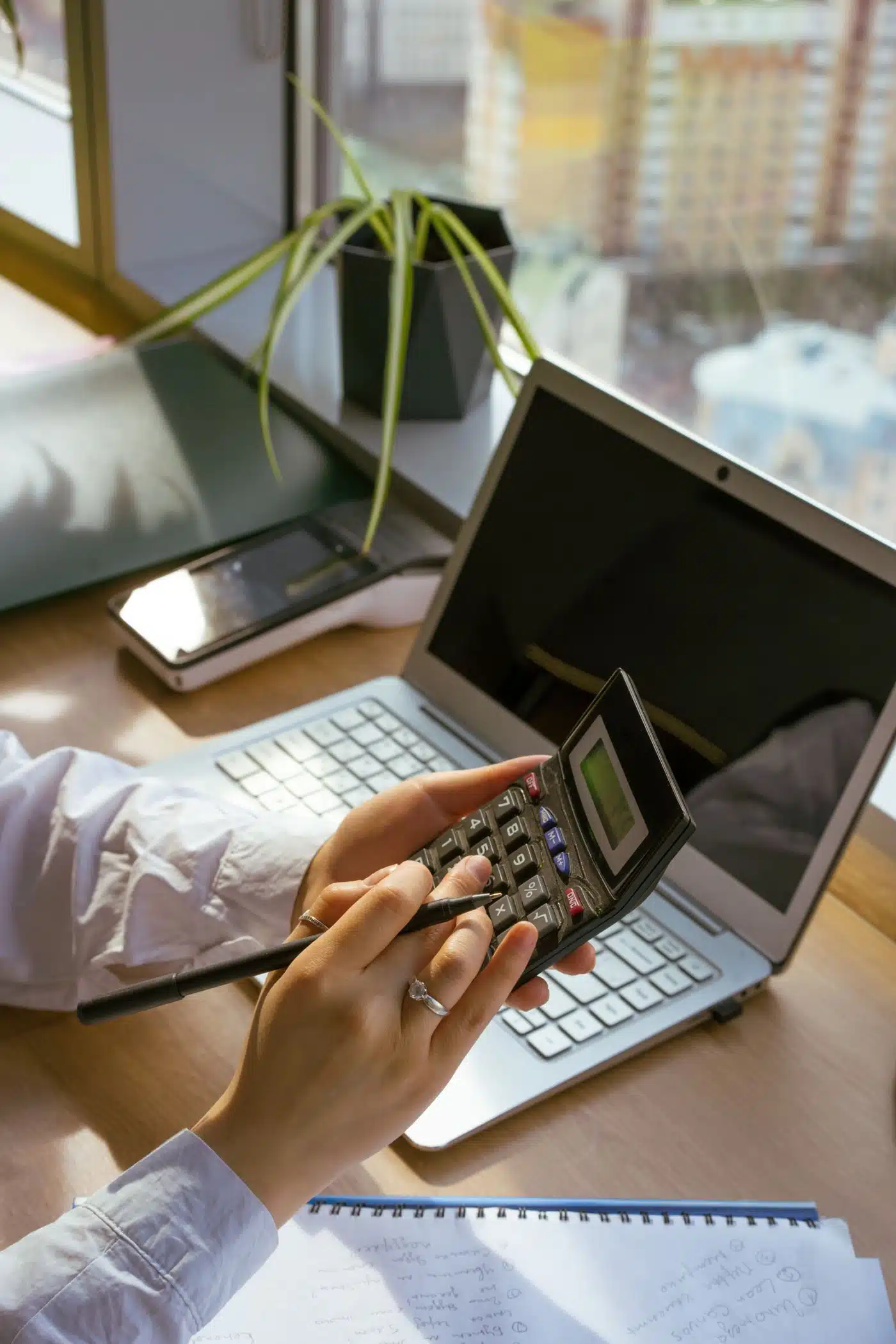 Owner checking the numbers before paying for custom software development