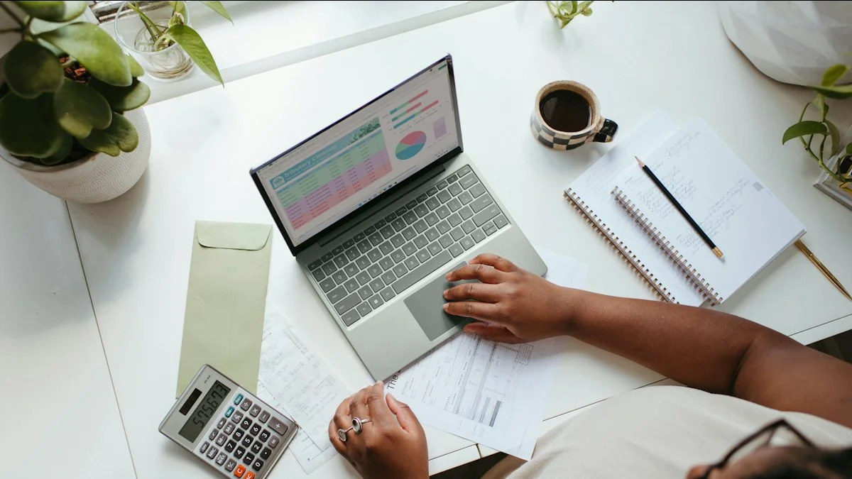 Business owner checking website quotes with a calculator and laptop before choosing a developer
