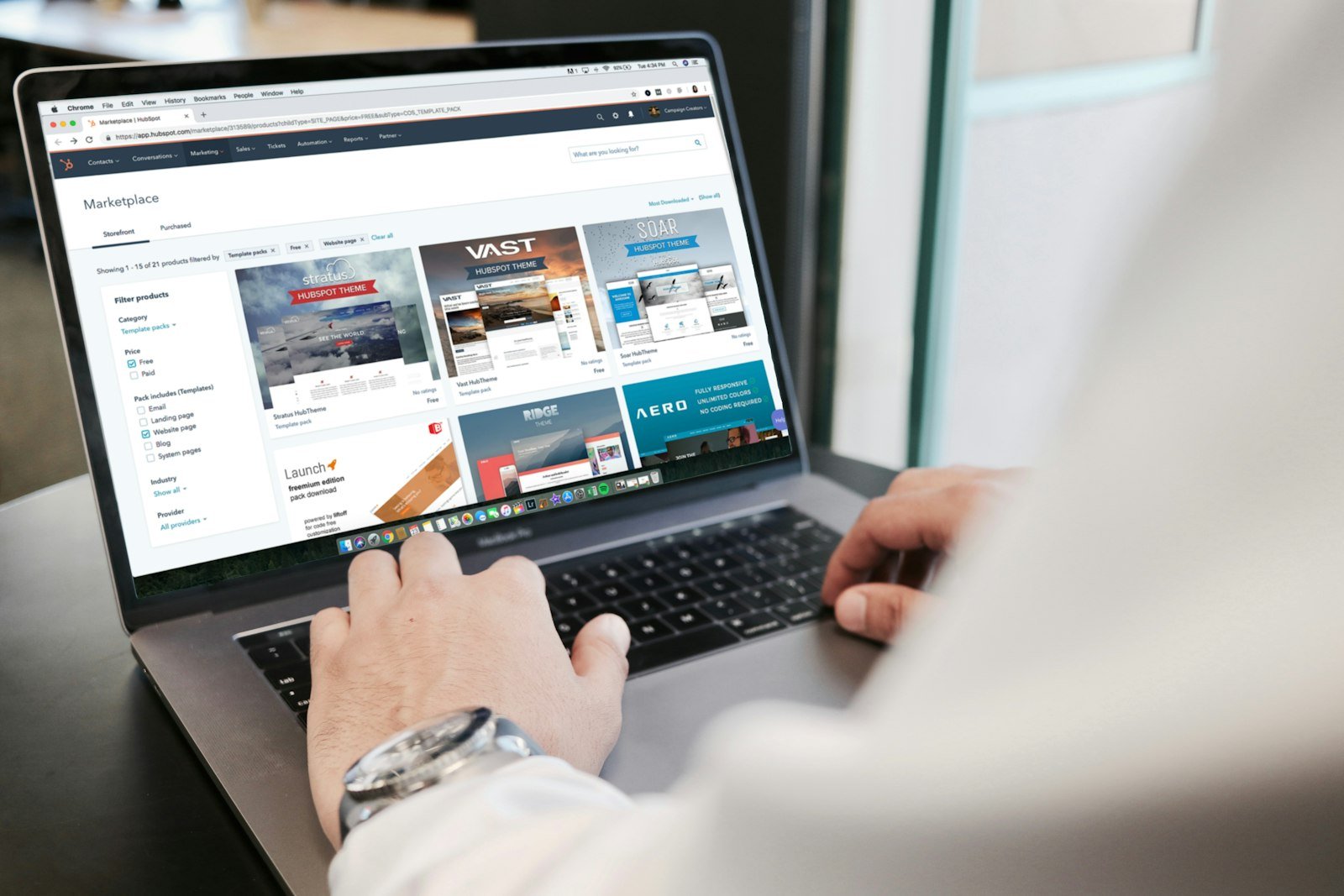 Business owner reviewing a custom website design on a laptop